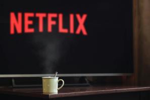 photo of cup near flat screen television