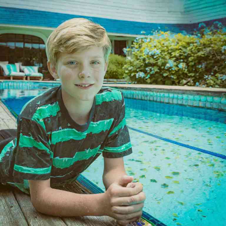 Poolside, inhaling the subtle scent of chlorine after a long day of swimming.