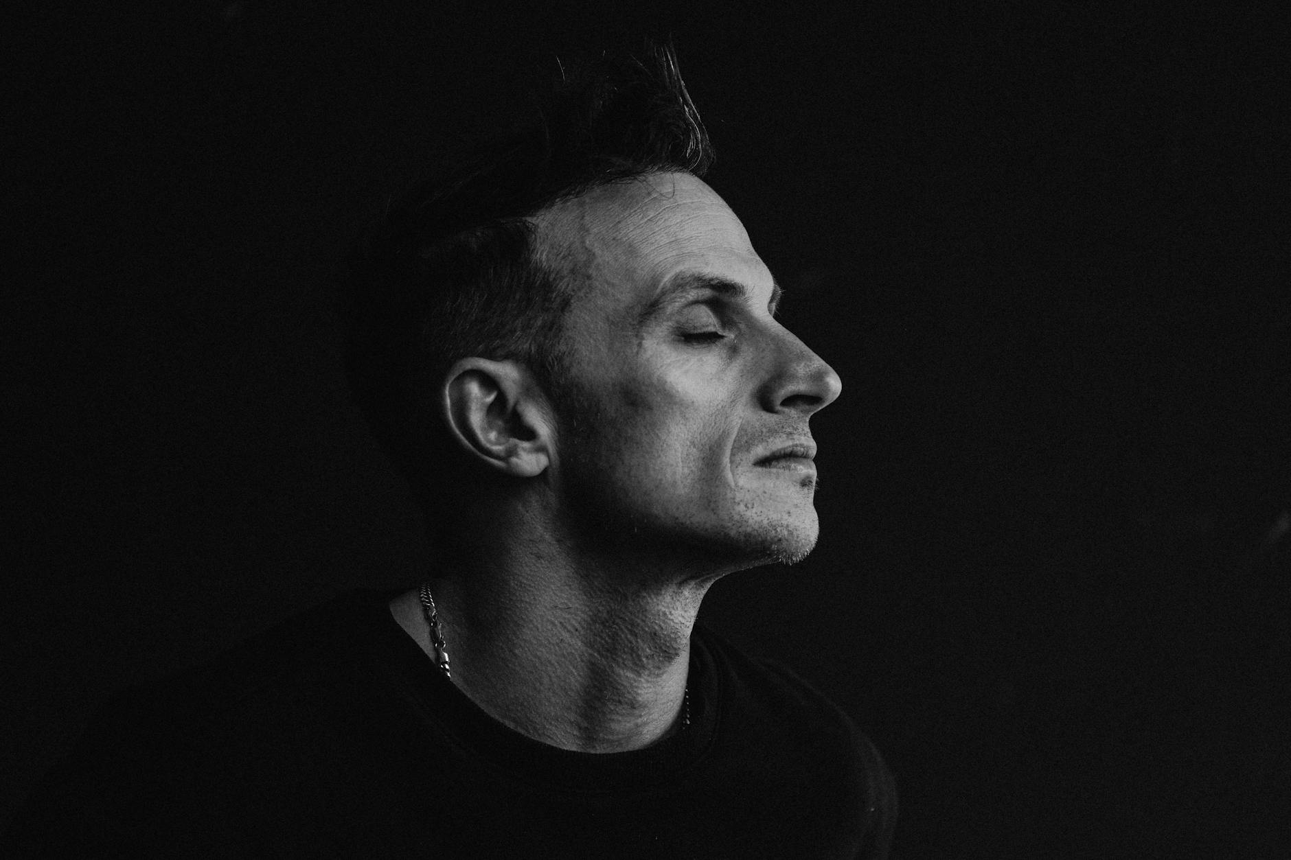 black and white portrait of a reflective man