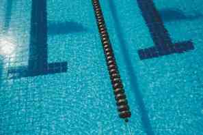 roll shaped lane marker in swimming pool with shiny water