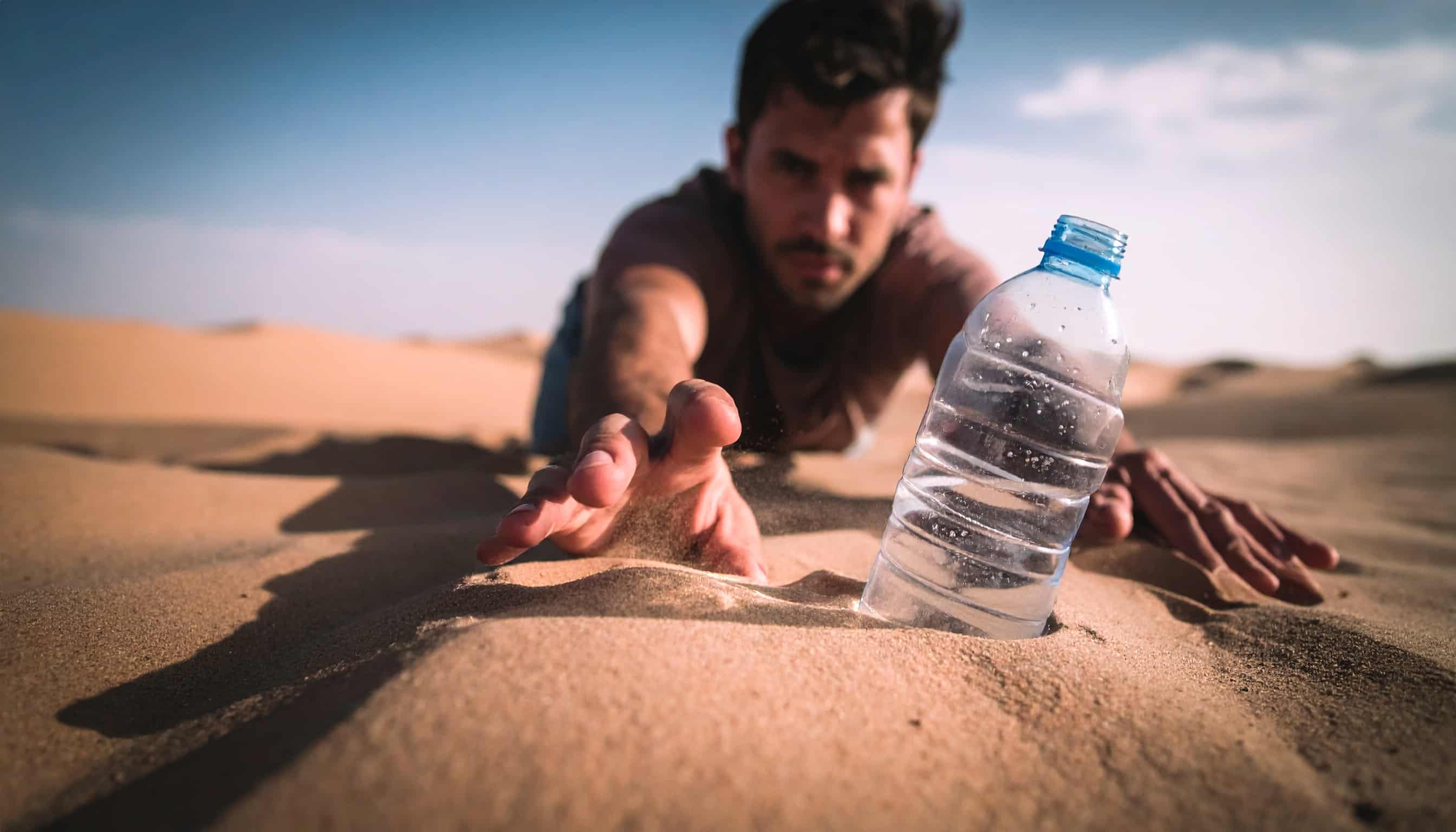 reaching for a bottled water