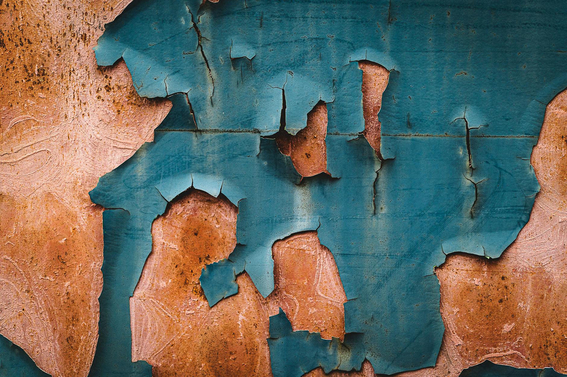 peeling blue paint on a wall