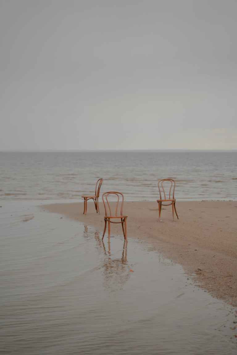 empty chairs on beach